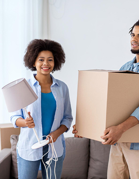 Professional movers carrying boxes